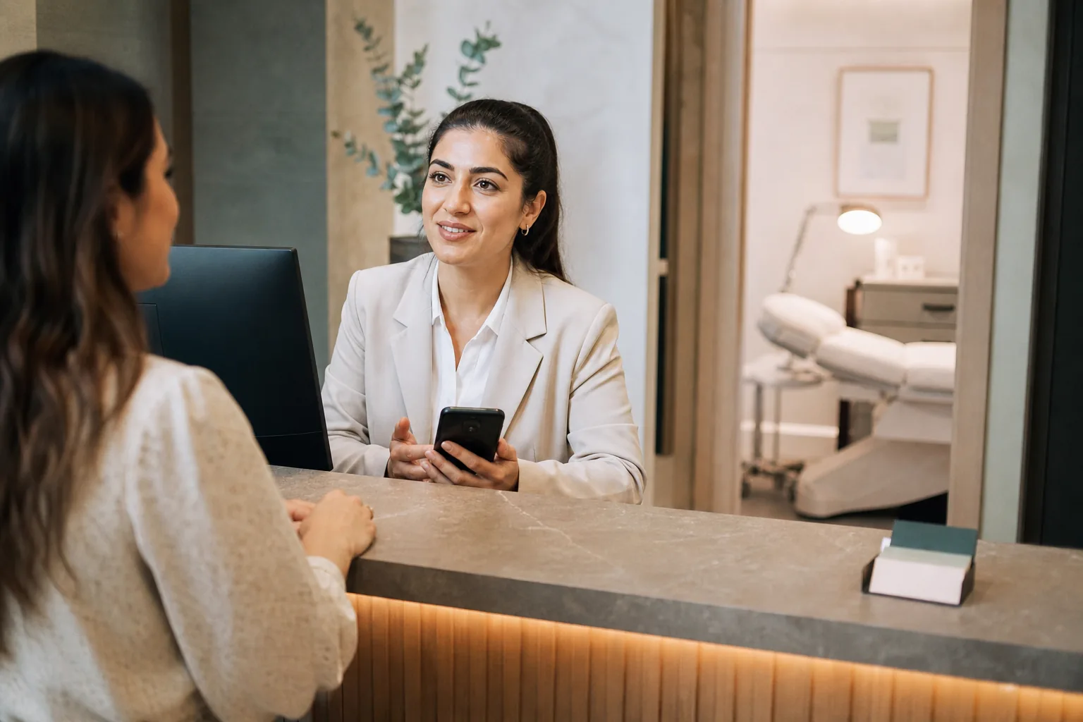Adviser and client reviewing an appointment in a modern clinic